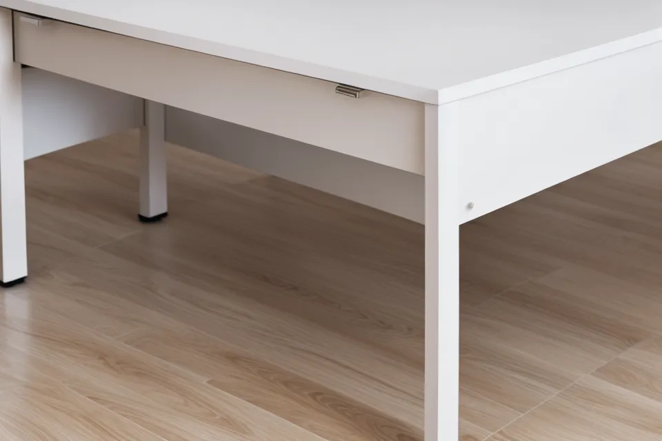 Leg columns and floor-leveling glides on this minimalist standing desk from Branch furniture